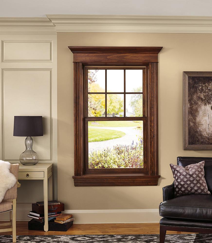 Custom wood-trimmed window in an elegant living room